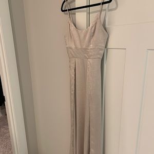 Small champagne formal dress with a slit.